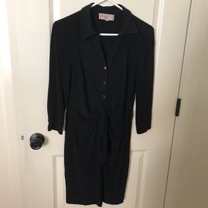 Black dress with gold colored buttons